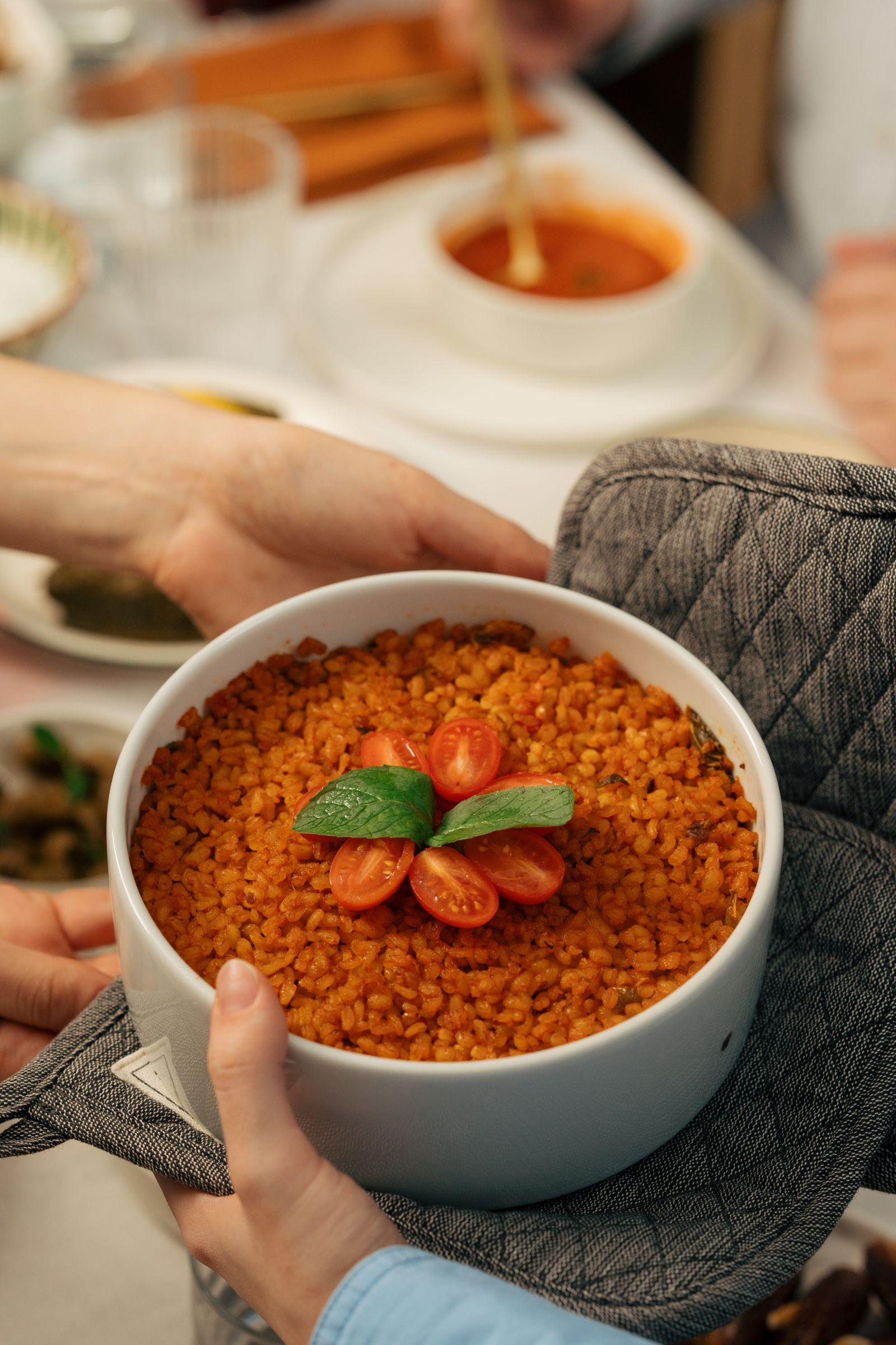 A neighbor handing over a homemade dish, still warm from the oven
